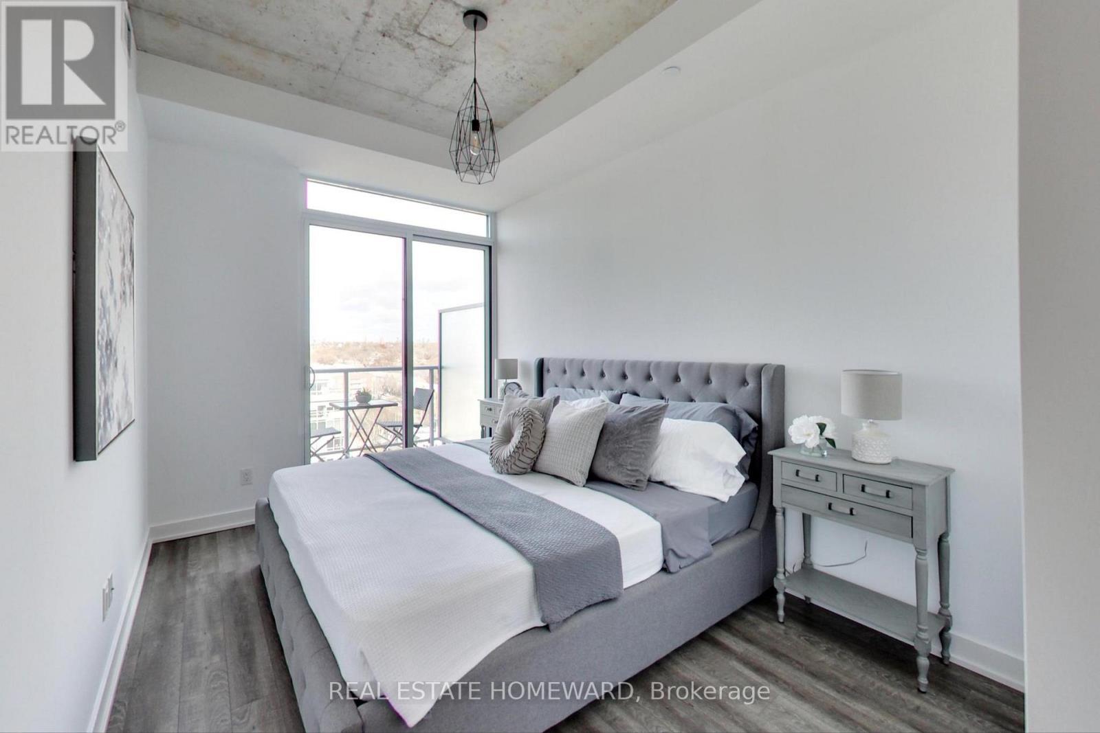 Primary Bedroom with King Size Bed - 1113 - 30 Baseball Place, Toronto, ON - Indoor Photo Showing Bedroom