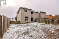Walk out from kitchen to fully fenced yard. -