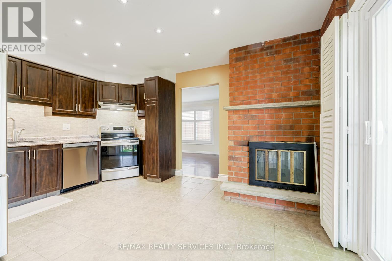 Upper - 4469 Gullfoot Circle, Mississauga, ON - Indoor Photo Showing Kitchen With Fireplace