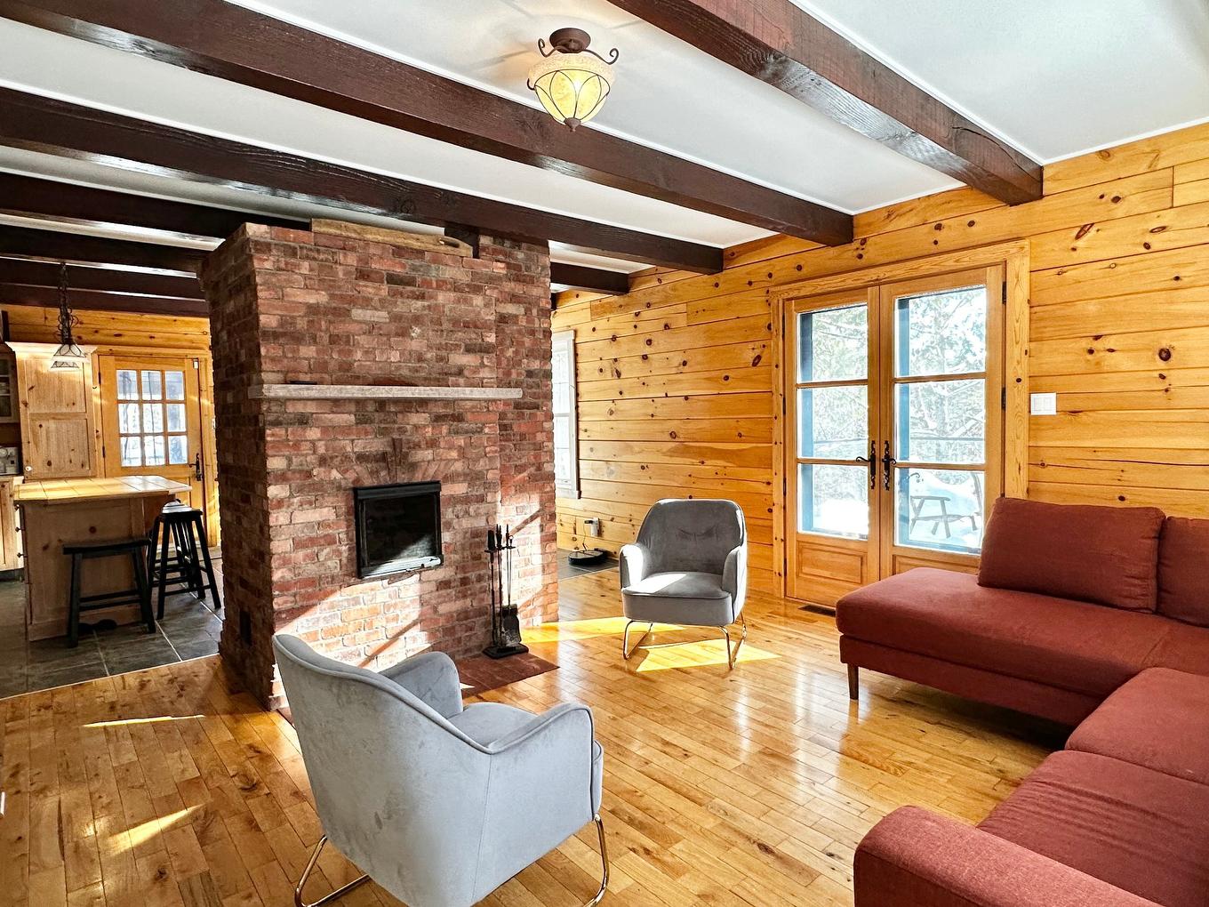 Living room - 2178 Ch. De La Gare, Val-Morin, QC - Indoor Photo Showing Living Room With Fireplace