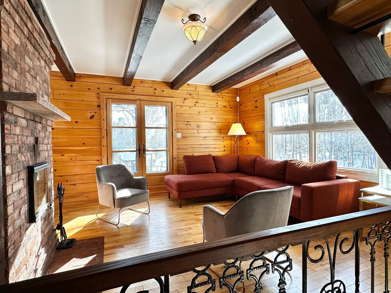 Living room - 2178 Ch. De La Gare, Val-Morin, QC - Indoor Photo Showing Living Room With Fireplace
