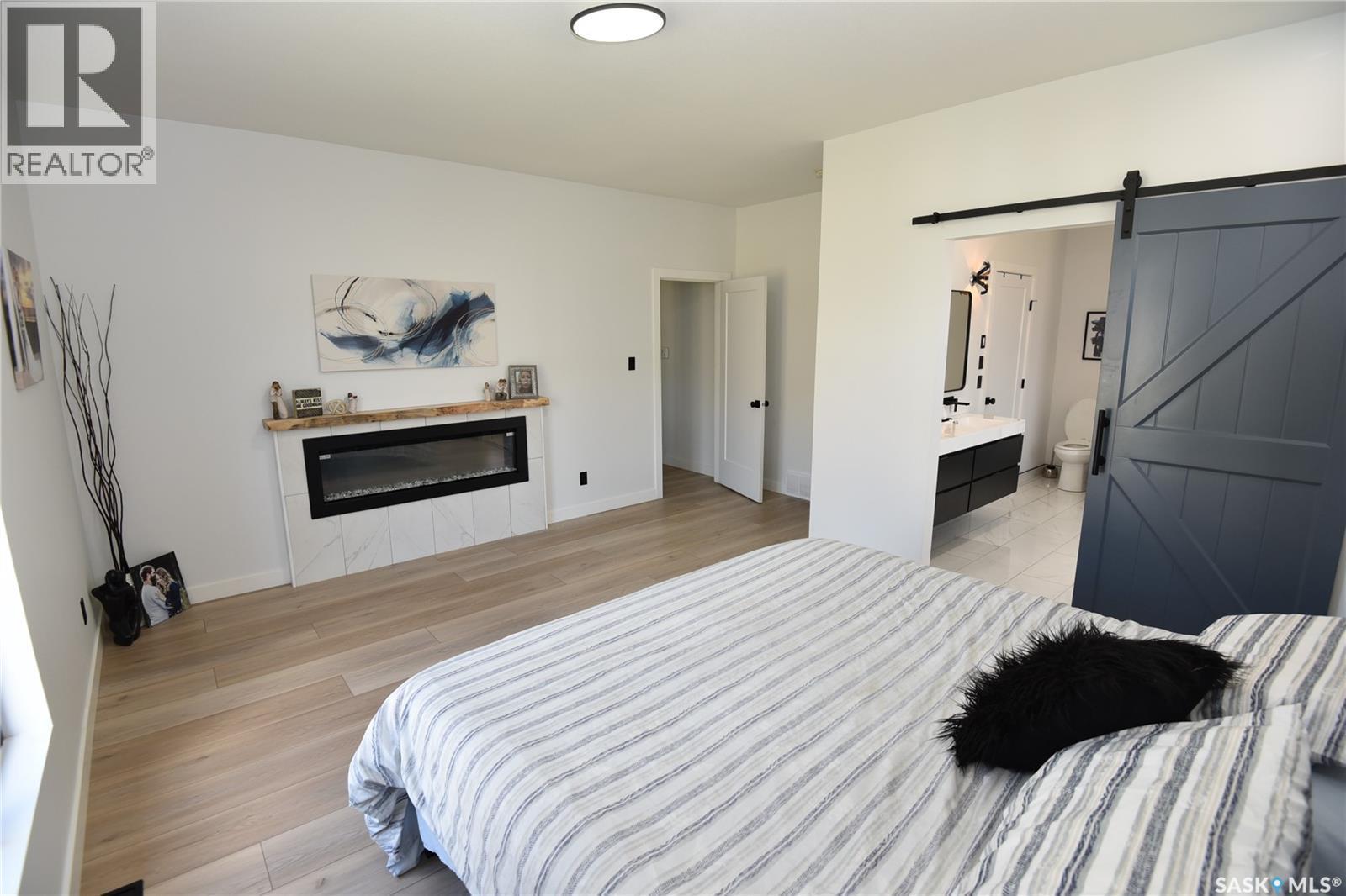 302 Coventry Crescent, Nipawin, SK - Indoor Photo Showing Bedroom With Fireplace