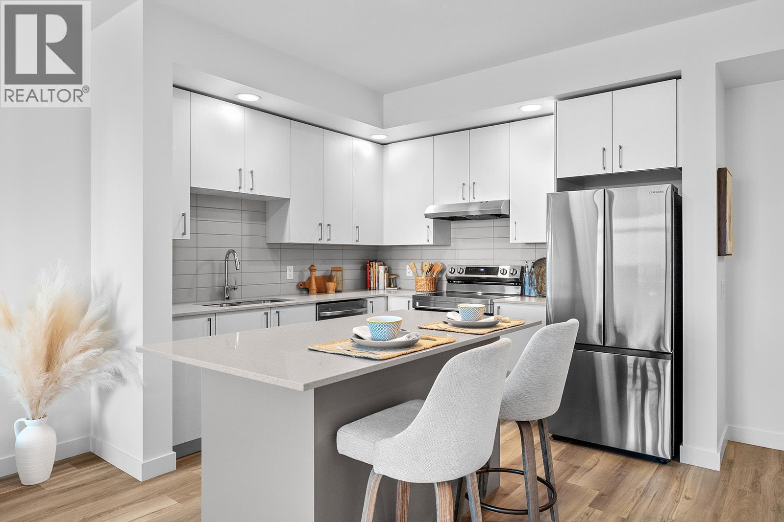 Welcome to #303 1057 Frost Road! Photos are of a similar home; some features may vary - 1057 Frost Road Unit# 303, Kelowna, BC - Indoor Photo Showing Kitchen With Stainless Steel Kitchen