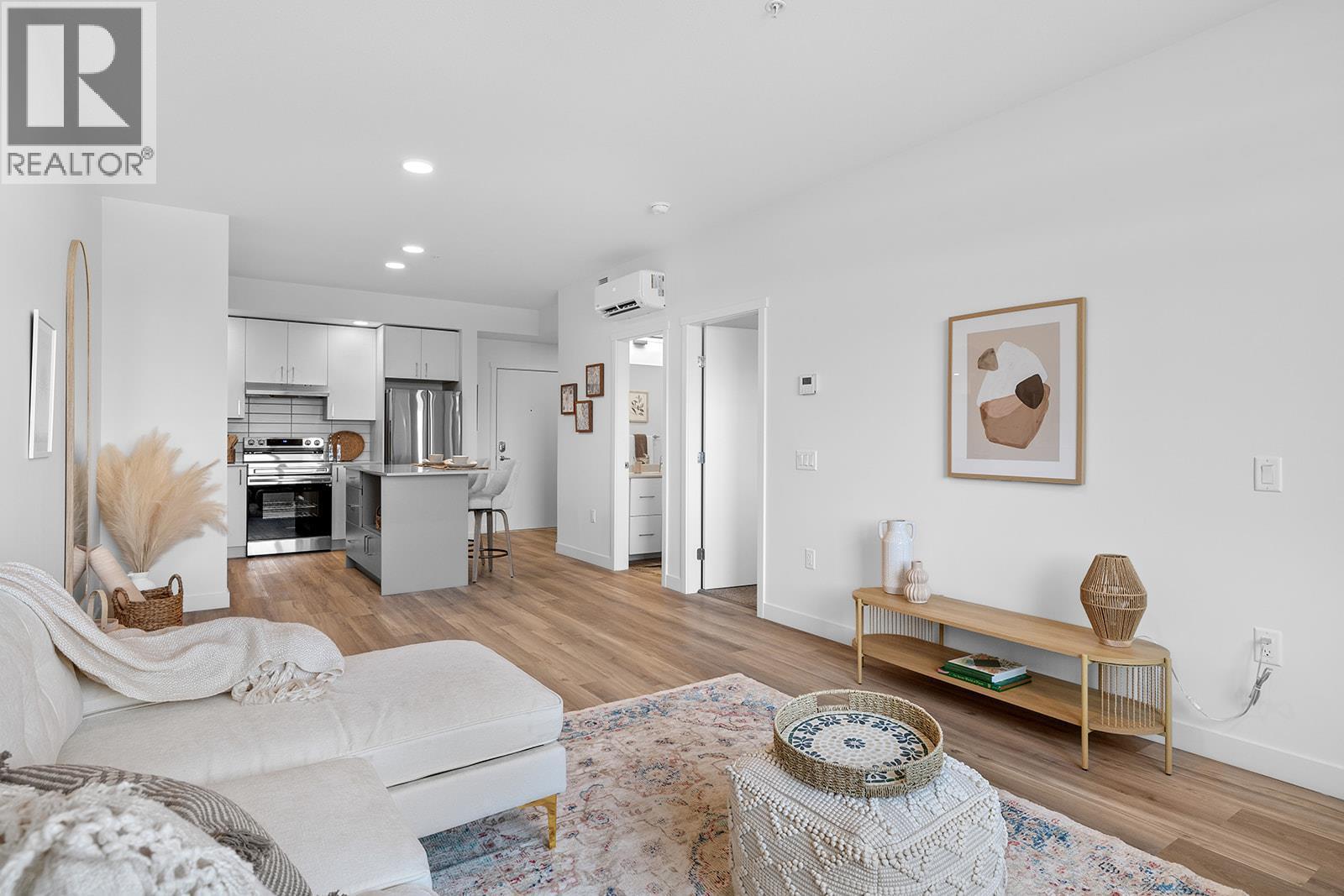 Photos are of a similar home; some features may vary - 1057 Frost Road Unit# 303, Kelowna, BC - Indoor Photo Showing Living Room