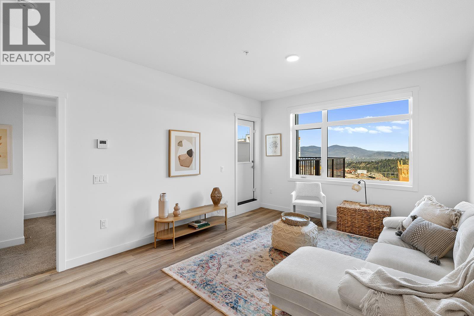 Photos are of a similar home; some features may vary - 1057 Frost Road Unit# 303, Kelowna, BC - Indoor Photo Showing Living Room