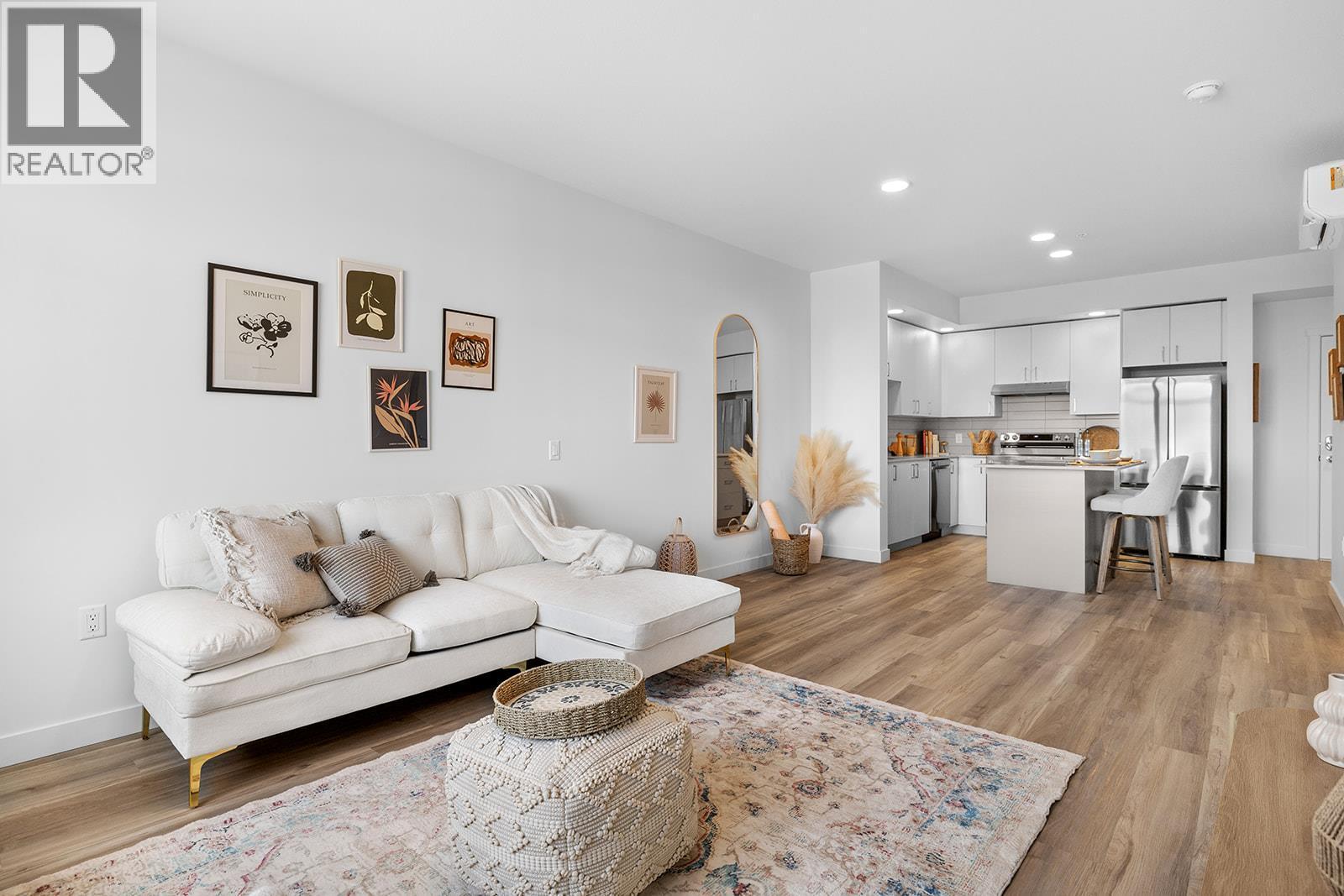 Photos are of a similar home; some features may vary - 1057 Frost Road Unit# 303, Kelowna, BC - Indoor Photo Showing Living Room