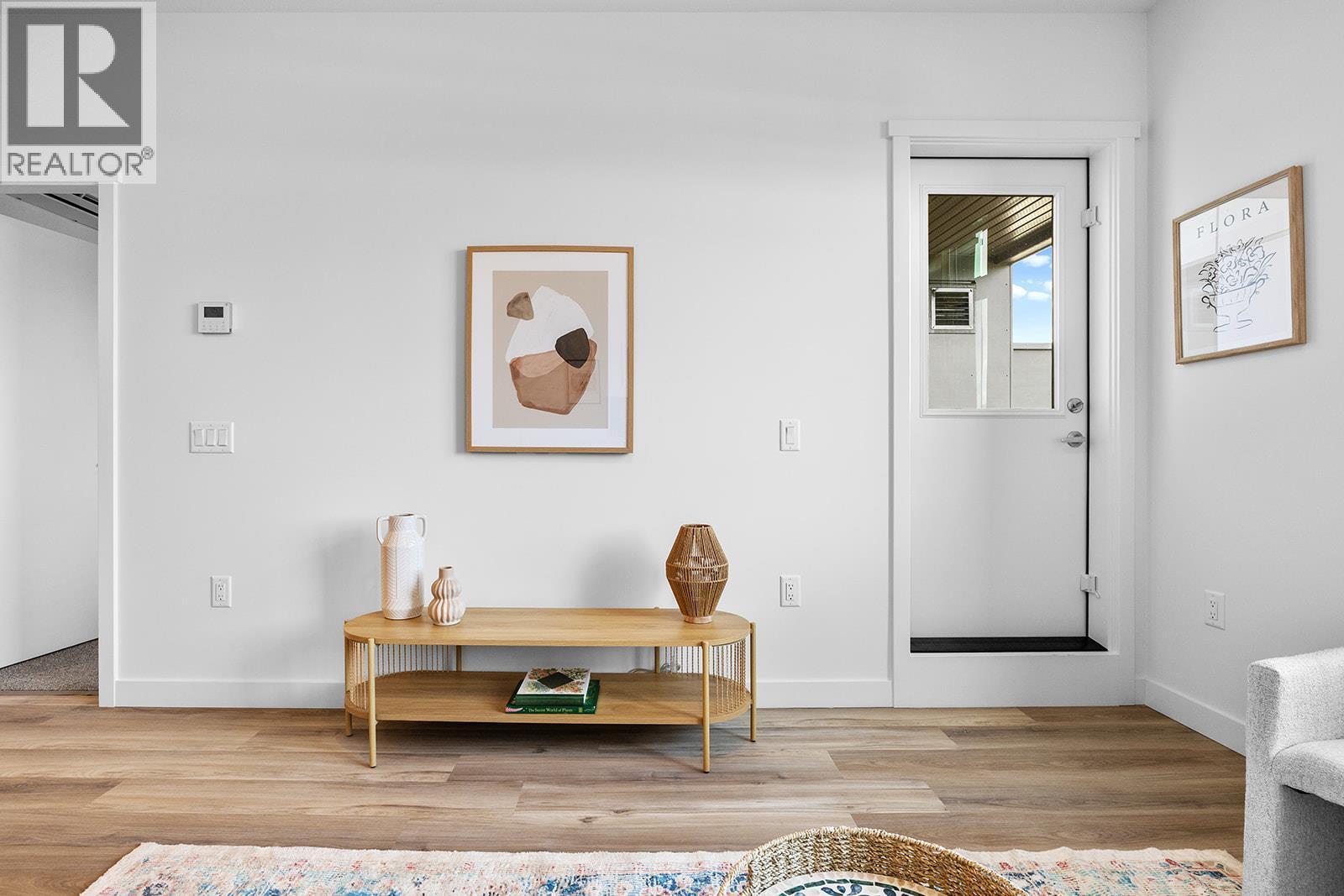 Photos are of a similar home; some features may vary - 1057 Frost Road Unit# 303, Kelowna, BC - Indoor Photo Showing Living Room