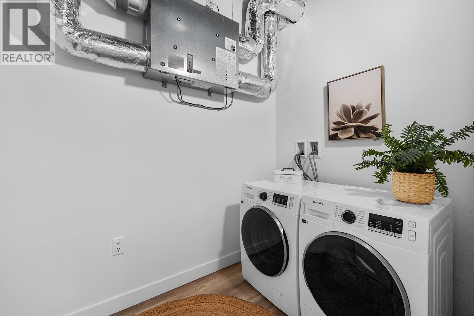 Photos are of a similar home; some features may vary - 1057 Frost Road Unit# 303, Kelowna, BC - Indoor Photo Showing Laundry Room