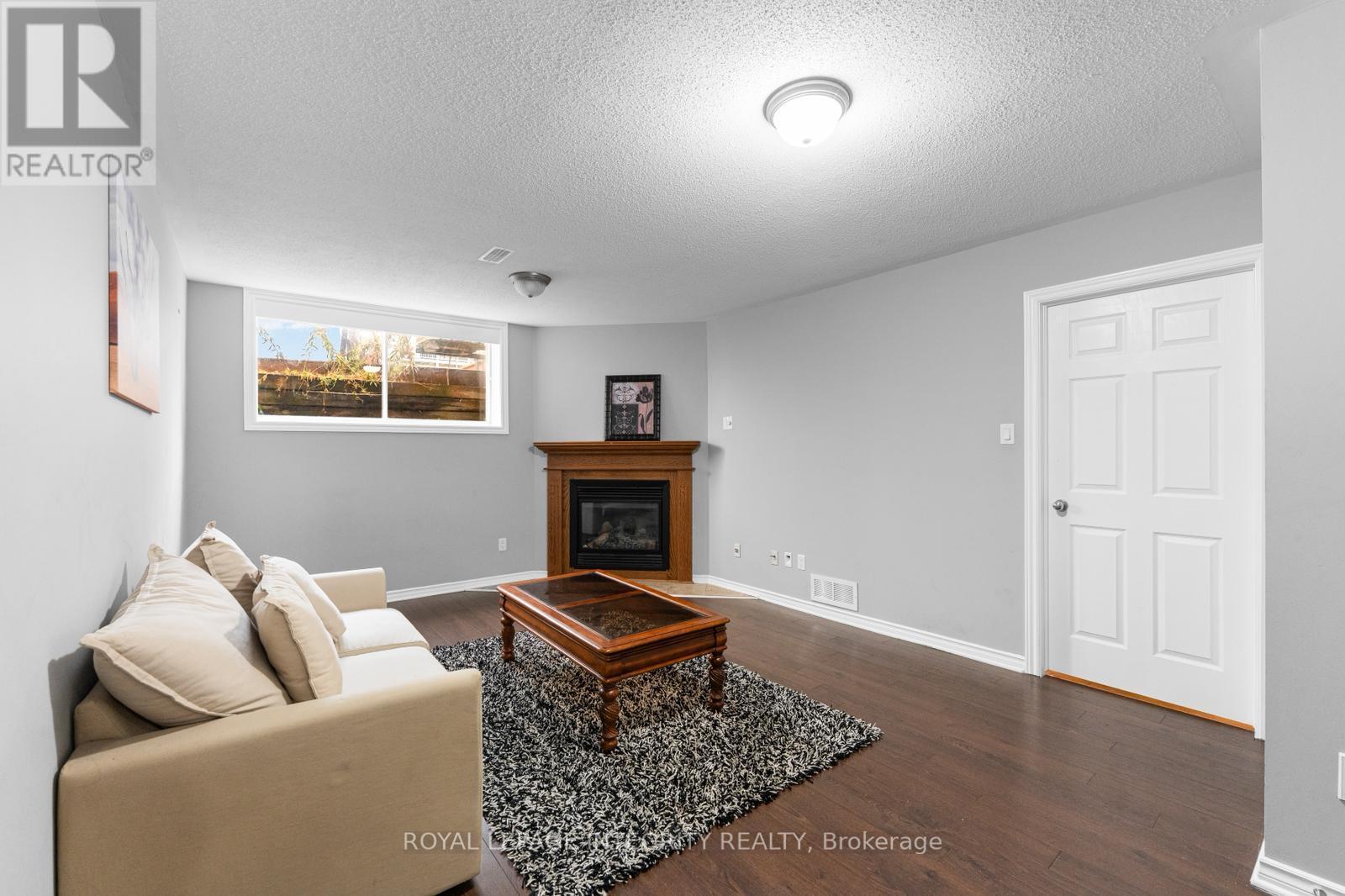 410 Goldenbrook Way, Ottawa, ON - Indoor Photo Showing Living Room With Fireplace