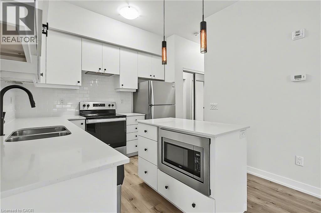 251 Northfield Drive E Unit# 103, Waterloo, ON - Indoor Photo Showing Kitchen With Stainless Steel Kitchen With Double Sink With Upgraded Kitchen