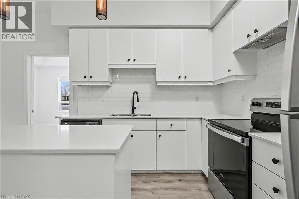 251 Northfield Drive E Unit# 103, Waterloo, ON - Indoor Photo Showing Kitchen With Stainless Steel Kitchen With Double Sink