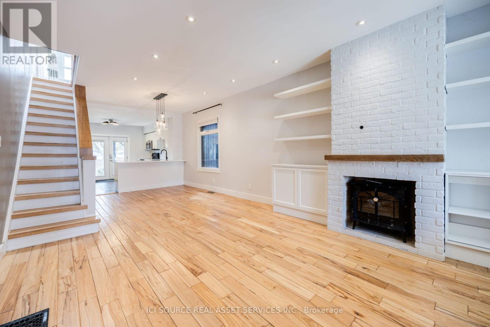 Main - 24 Pape Avenue, Toronto, ON - Indoor With Fireplace