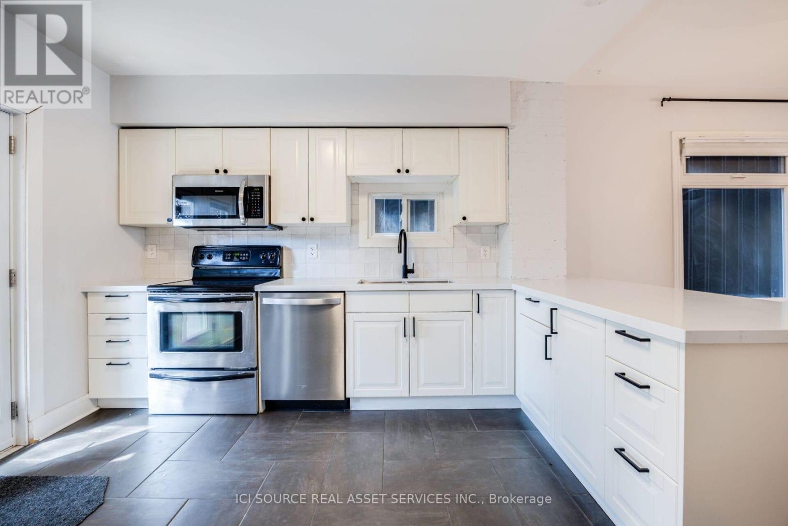 Main - 24 Pape Avenue, Toronto, ON - Indoor Photo Showing Kitchen With Double Sink