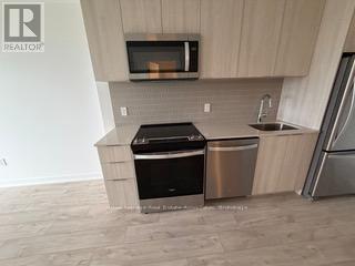 313 - 720 Whitlock Avenue, Milton, ON - Indoor Photo Showing Kitchen With Stainless Steel Kitchen