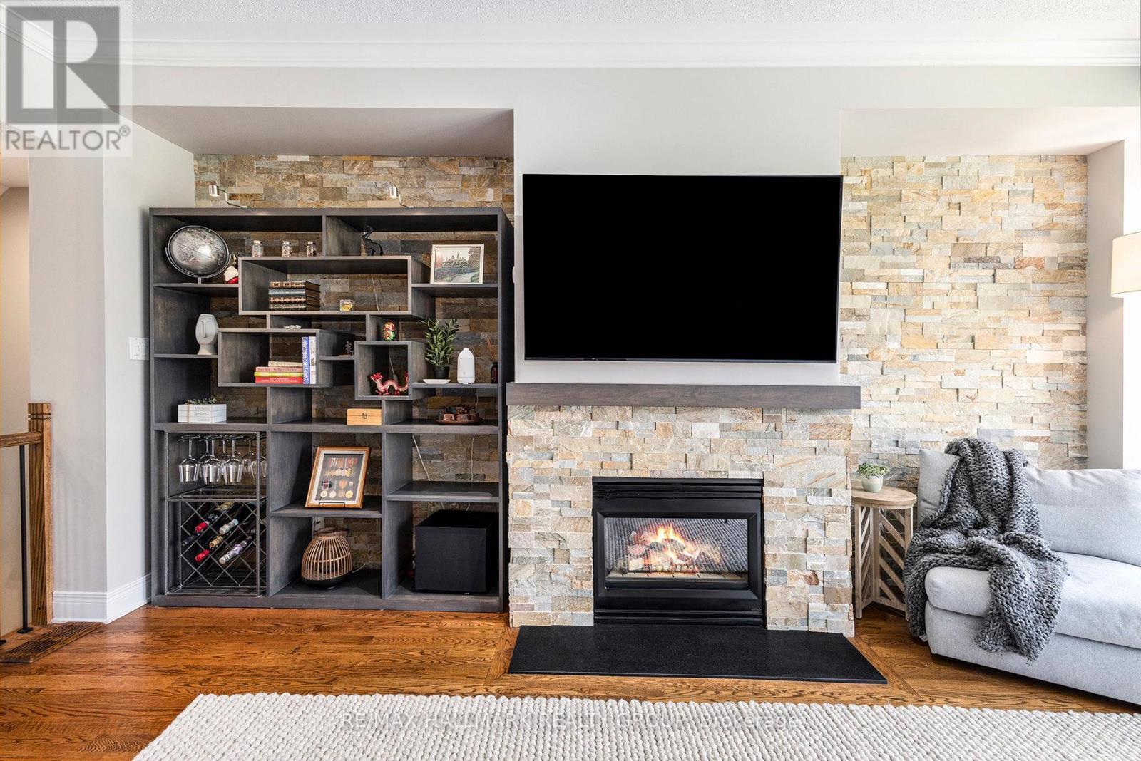 56 Kings Landing Private, Ottawa, ON - Indoor Photo Showing Living Room With Fireplace