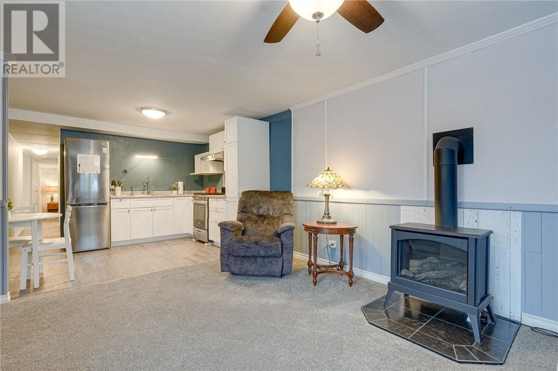 411 Black Lake Road Unit# 15, Lively, ON - Indoor Photo Showing Living Room With Fireplace