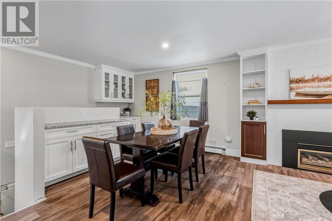 22 Sandra Street, Garson, ON - Indoor Photo Showing Dining Room With Fireplace