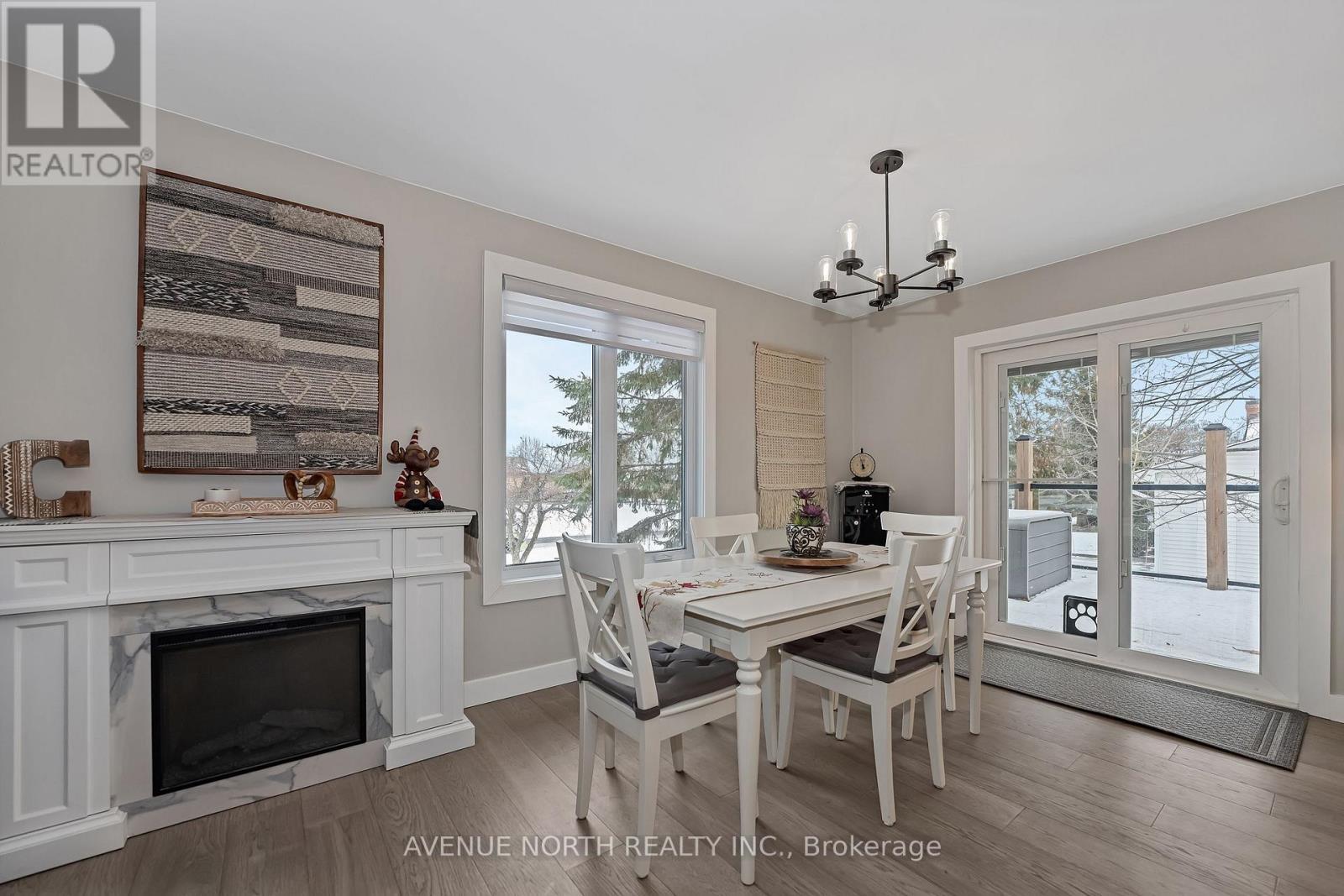 7028 Shadow Ridge Drive, Ottawa, ON - Indoor Photo Showing Dining Room With Fireplace