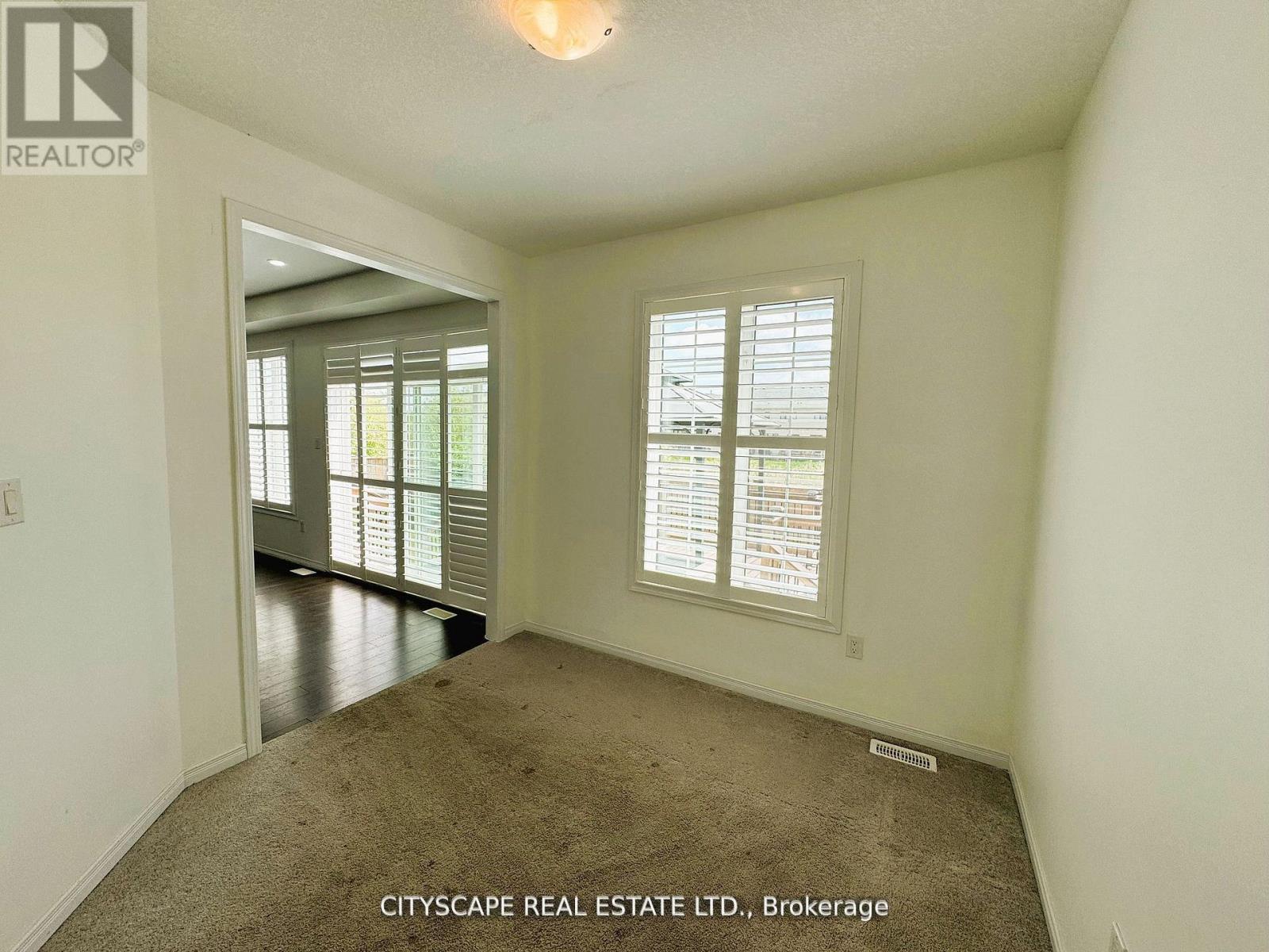 Main Floor Den/Office Overlooking Backyard - 7646 Goldenrod Trail, Niagara Falls, ON - Indoor Photo Showing Other Room