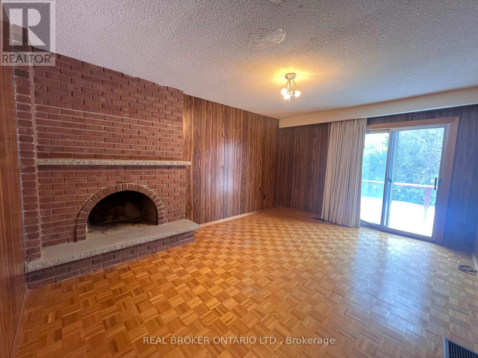 Family Room to Backyard Entrance - 41 Cleethorpes Boulevard, Toronto, ON - Indoor Photo Showing Other Room With Fireplace