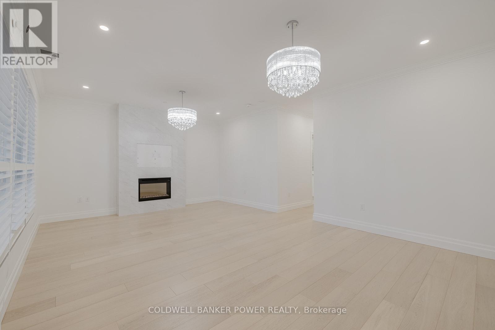 1103 - 260 Villagewalk Boulevard, London North (North R), ON - Indoor Photo Showing Other Room With Fireplace