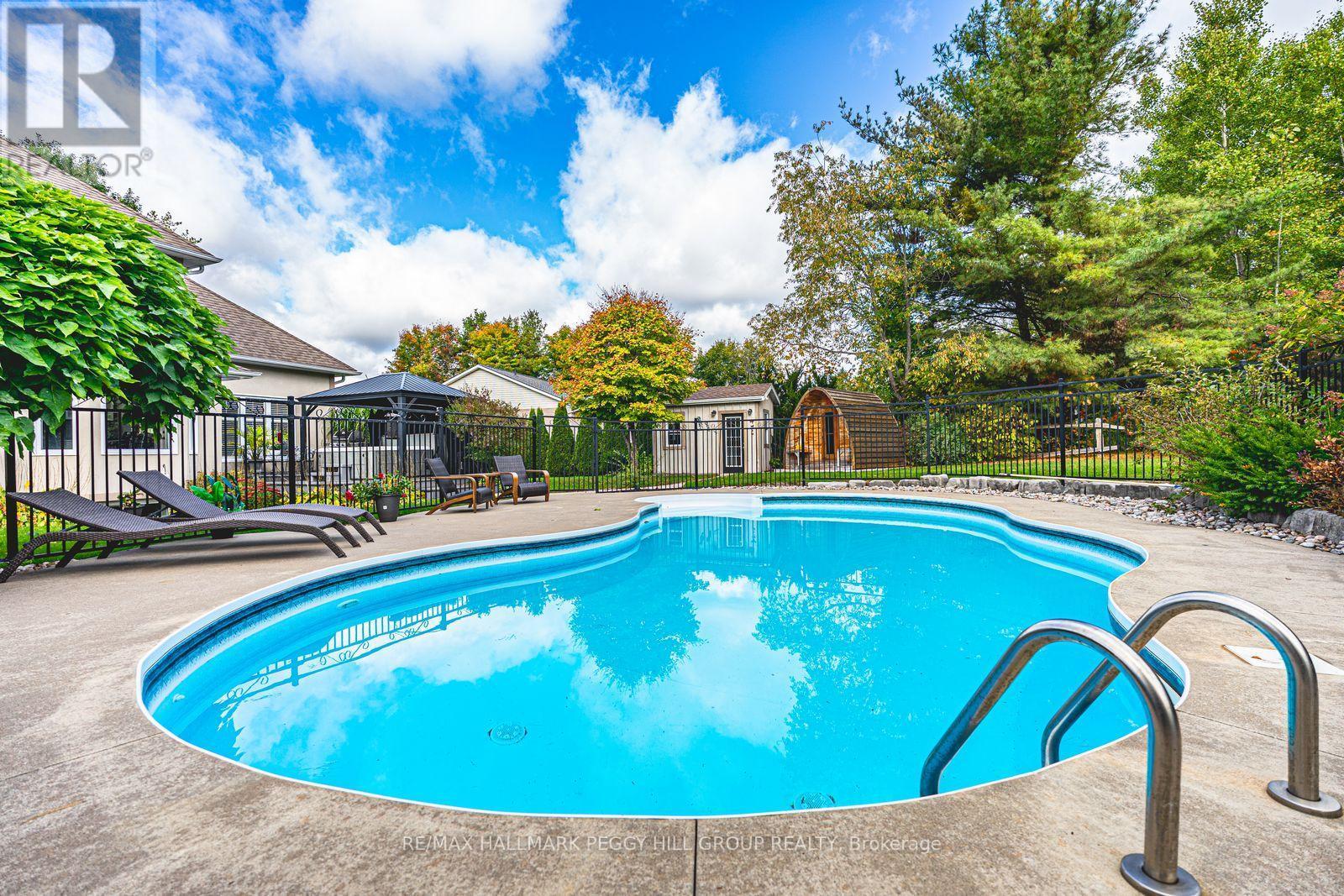 127 Goldfinch Crescent, Tiny, ON - Outdoor With In Ground Pool With Backyard