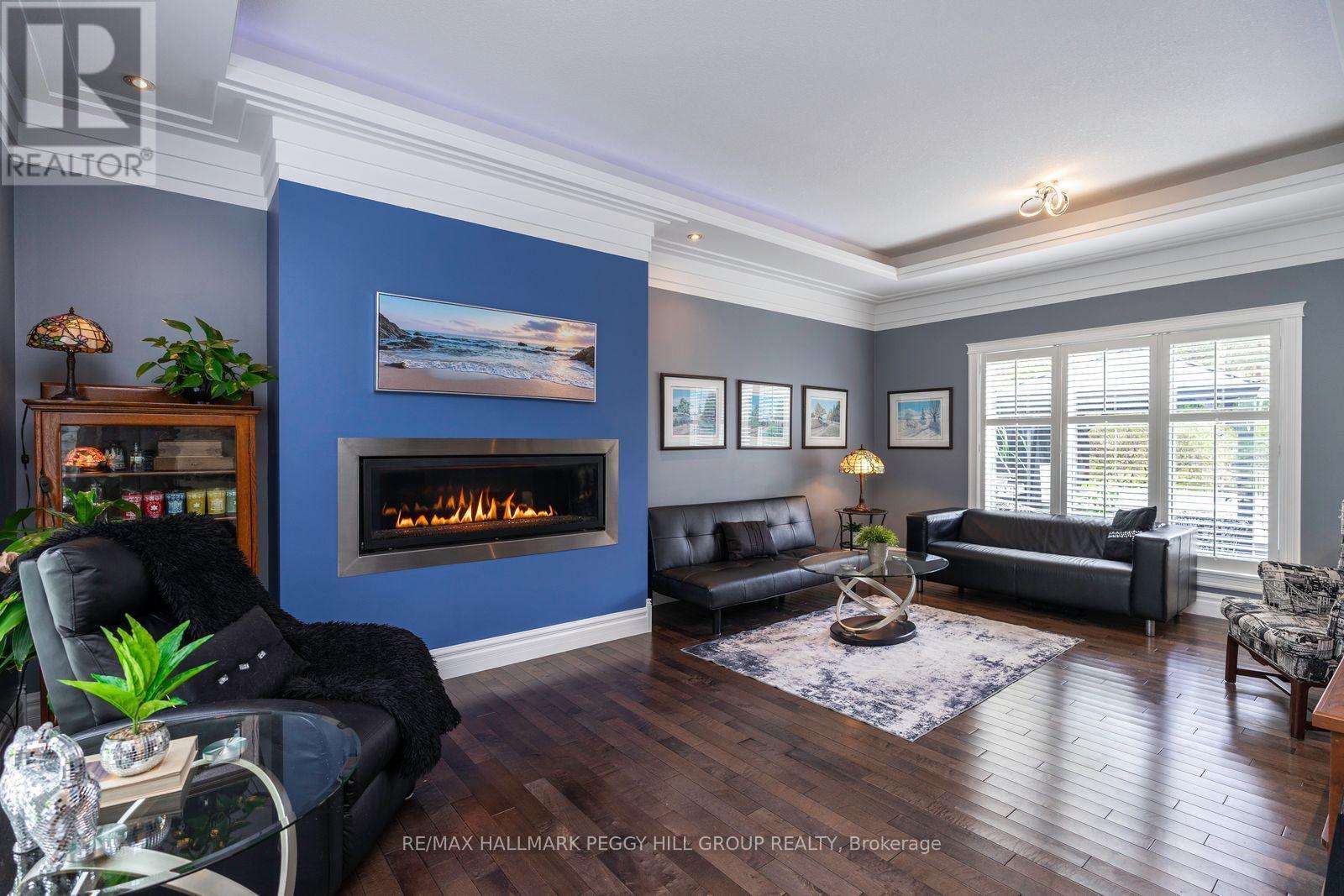 127 Goldfinch Crescent, Tiny, ON - Indoor Photo Showing Living Room With Fireplace