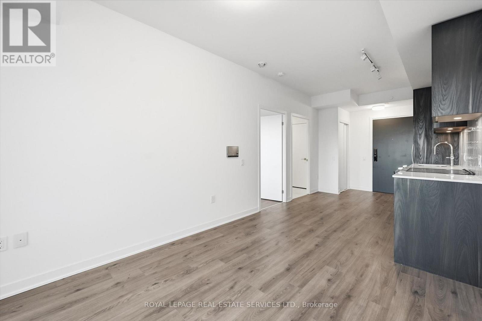 Wide-Plank Laminate Flooring Throughout - 603 - 395 Dundas Street W, Oakville, ON - Indoor Photo Showing Other Room