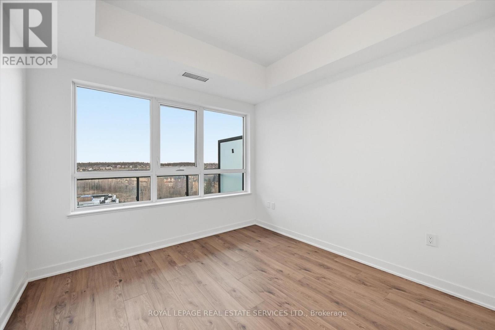 Bright Oversized Bedroom Offers a Walk-In Closet - 603 - 395 Dundas Street W, Oakville, ON - Indoor Photo Showing Other Room