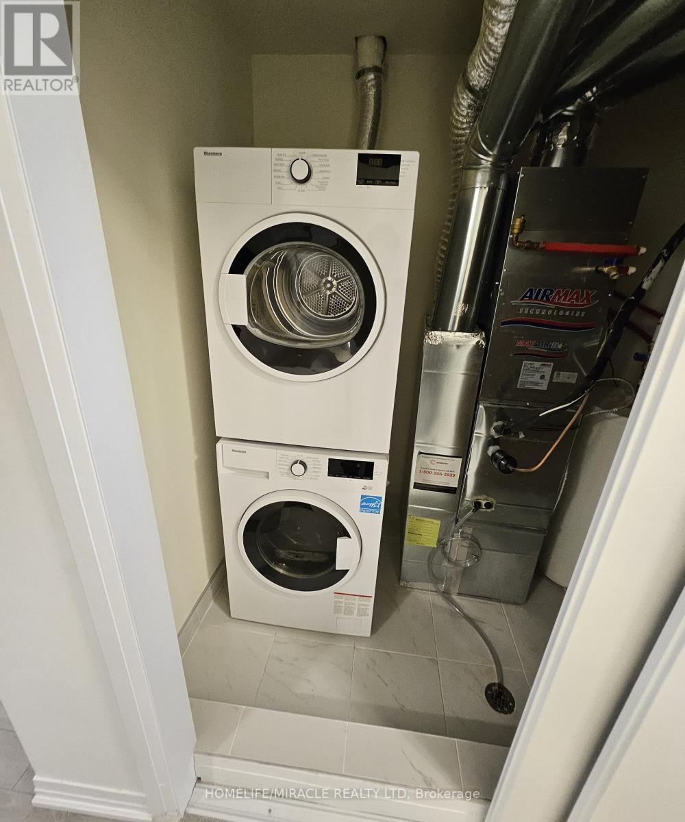 17 - 165 Tapscott Road, Toronto, ON - Indoor Photo Showing Laundry Room