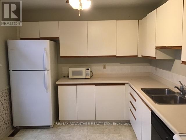4 - 1294 Byron Baseline Road W, London South (South K), ON - Indoor Photo Showing Kitchen With Double Sink