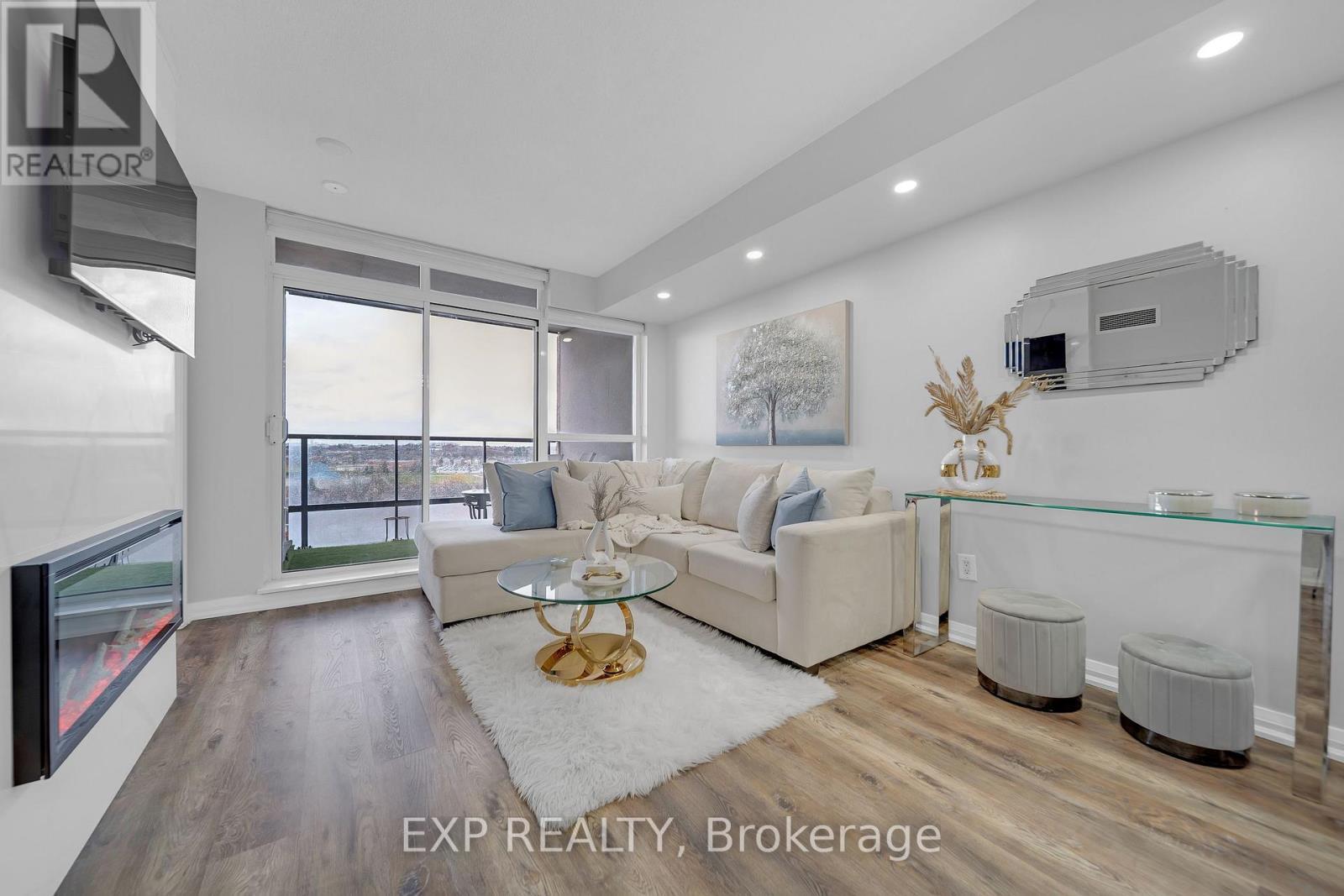 1009 - 220 Forum Drive, Mississauga, ON - Indoor Photo Showing Living Room With Fireplace