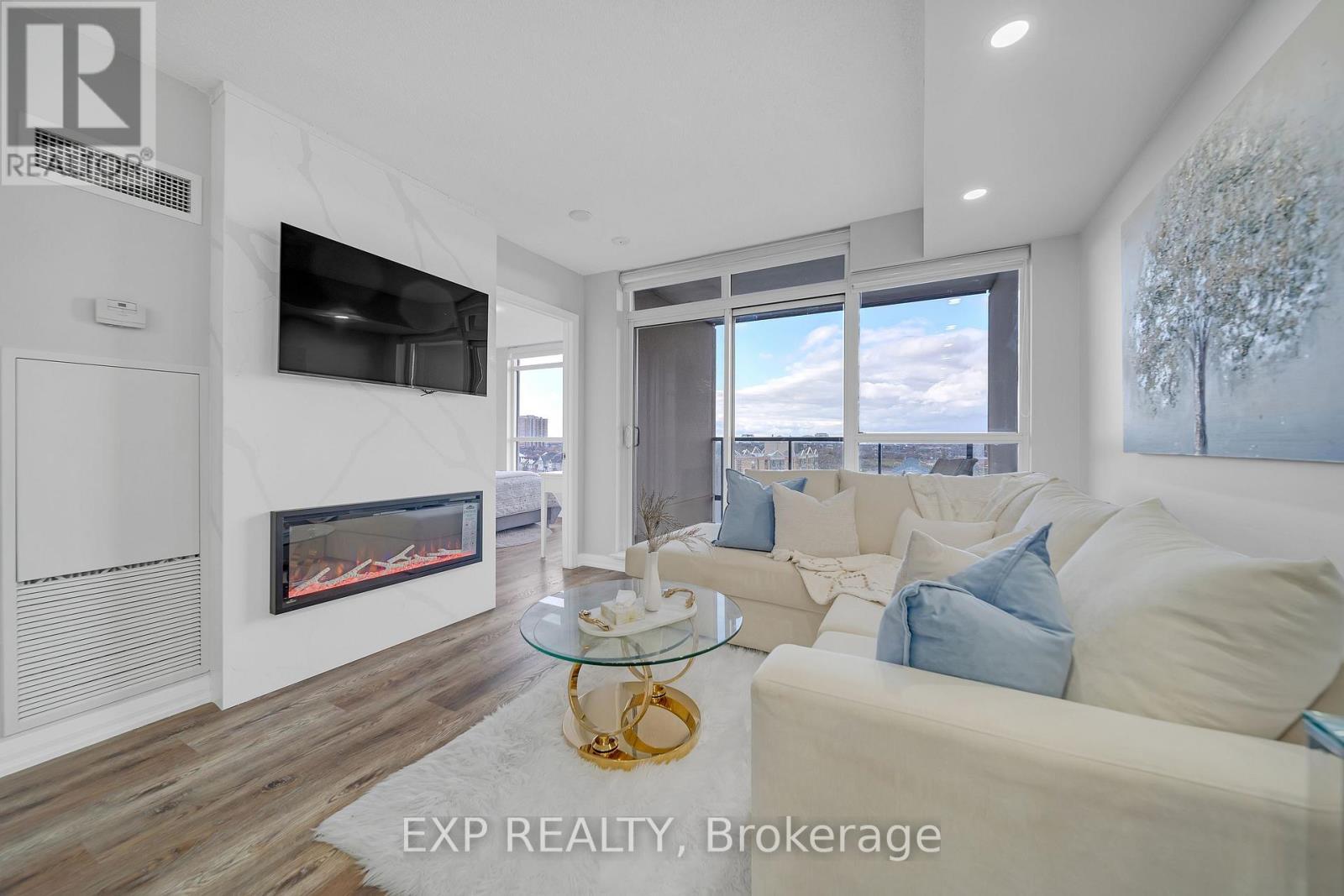 1009 - 220 Forum Drive, Mississauga, ON - Indoor Photo Showing Living Room With Fireplace