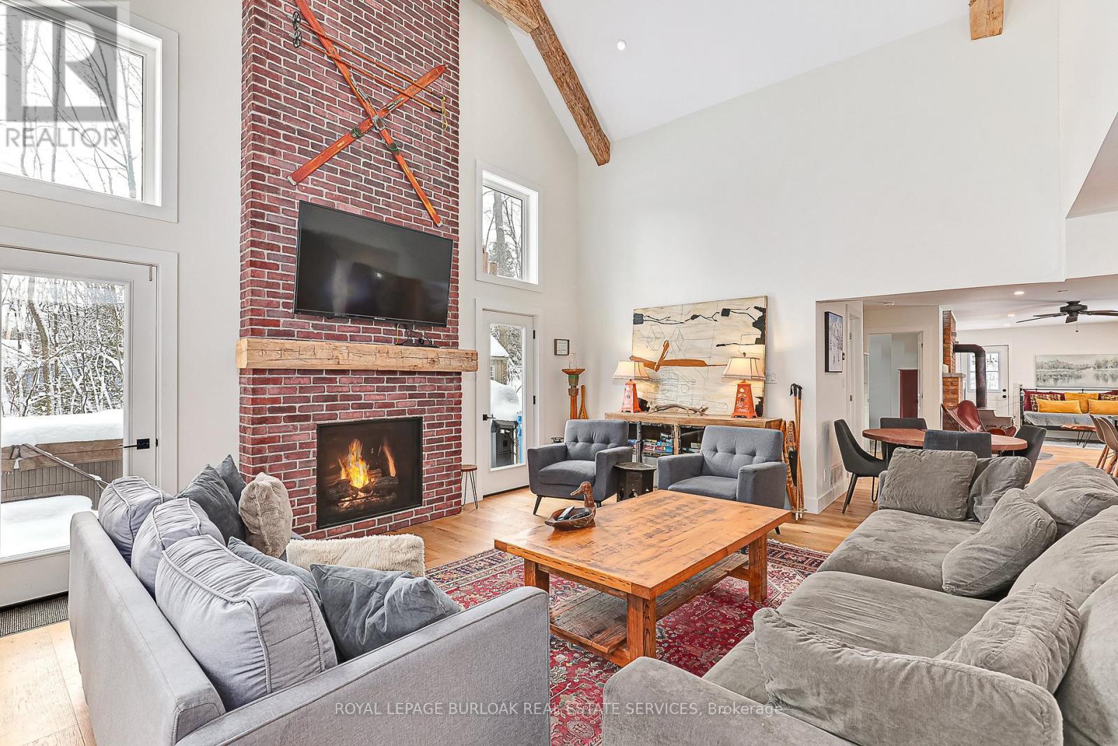 234 Canrobert Street, Grey Highlands, ON - Indoor Photo Showing Living Room With Fireplace