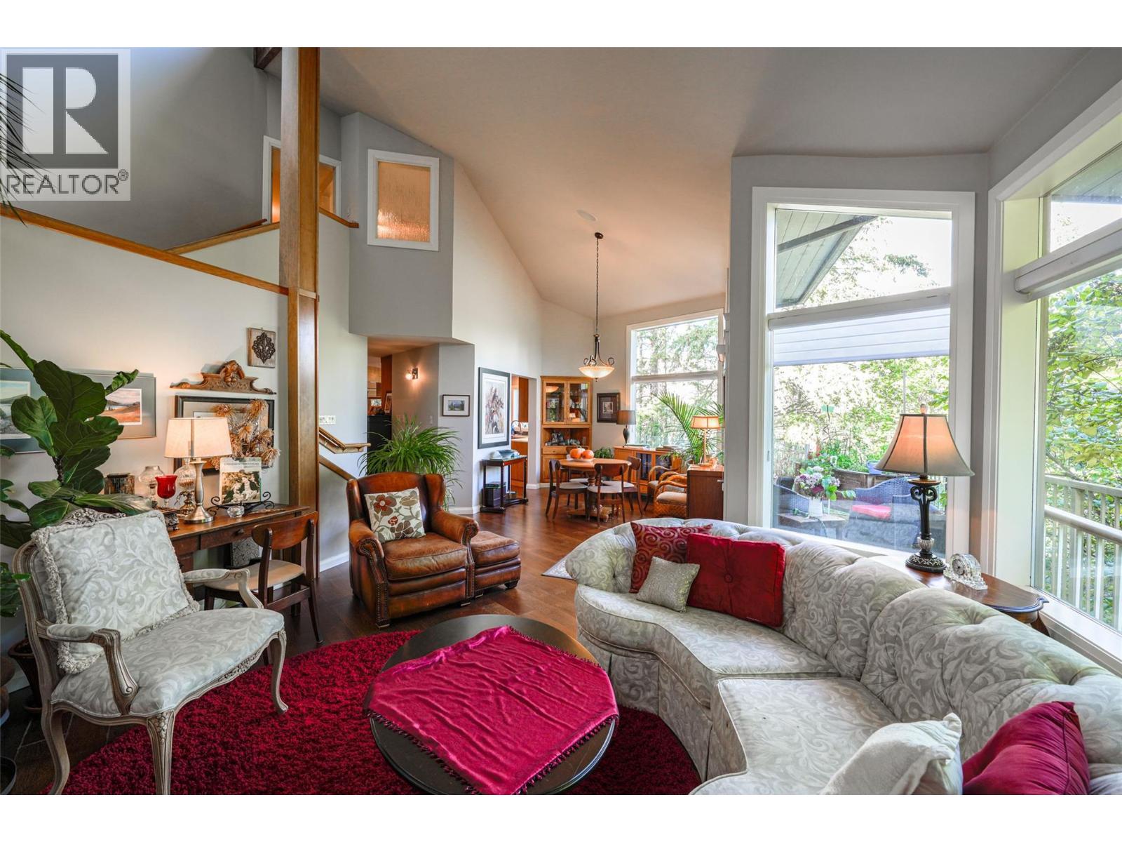 Living Room Looking towards Dining Room - 14038 Ponderosa Way, Coldstream, BC - Indoor Photo Showing Living Room