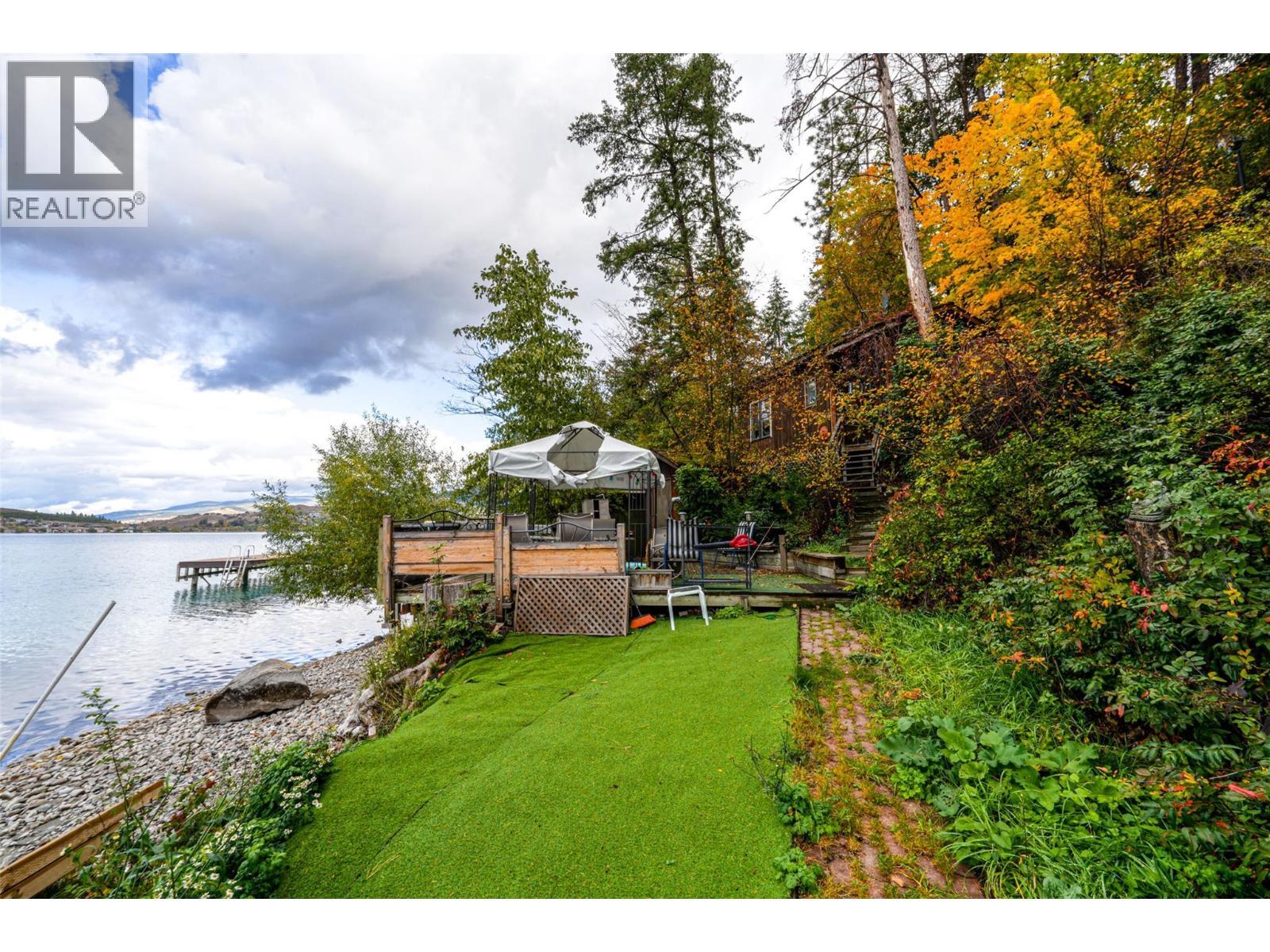 Grassy foreshore area - 14038 Ponderosa Way, Coldstream, BC - Outdoor With Body Of Water