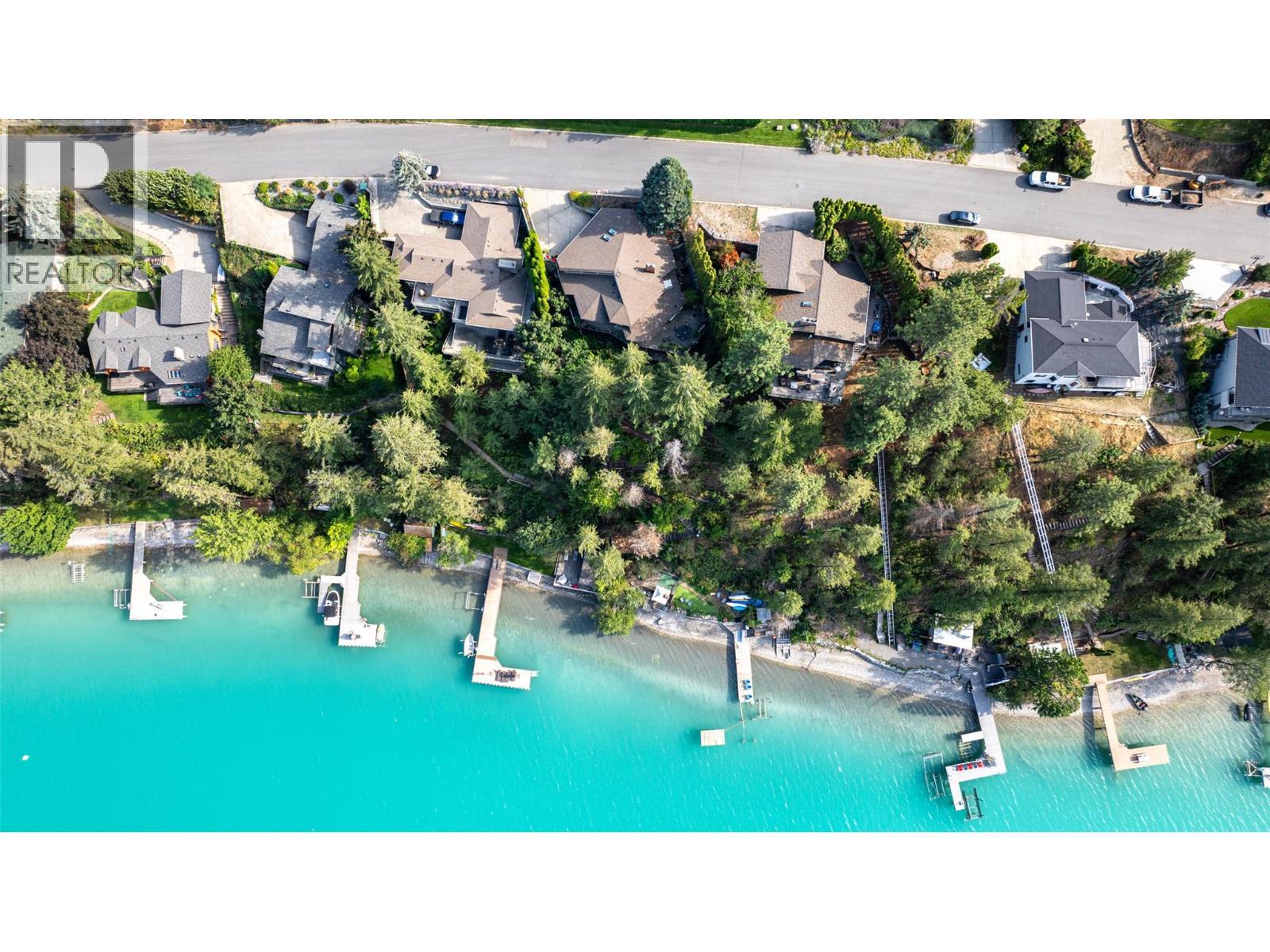 Aerial view of the dock and shoreline - 14038 Ponderosa Way, Coldstream, BC - Outdoor With Body Of Water With View