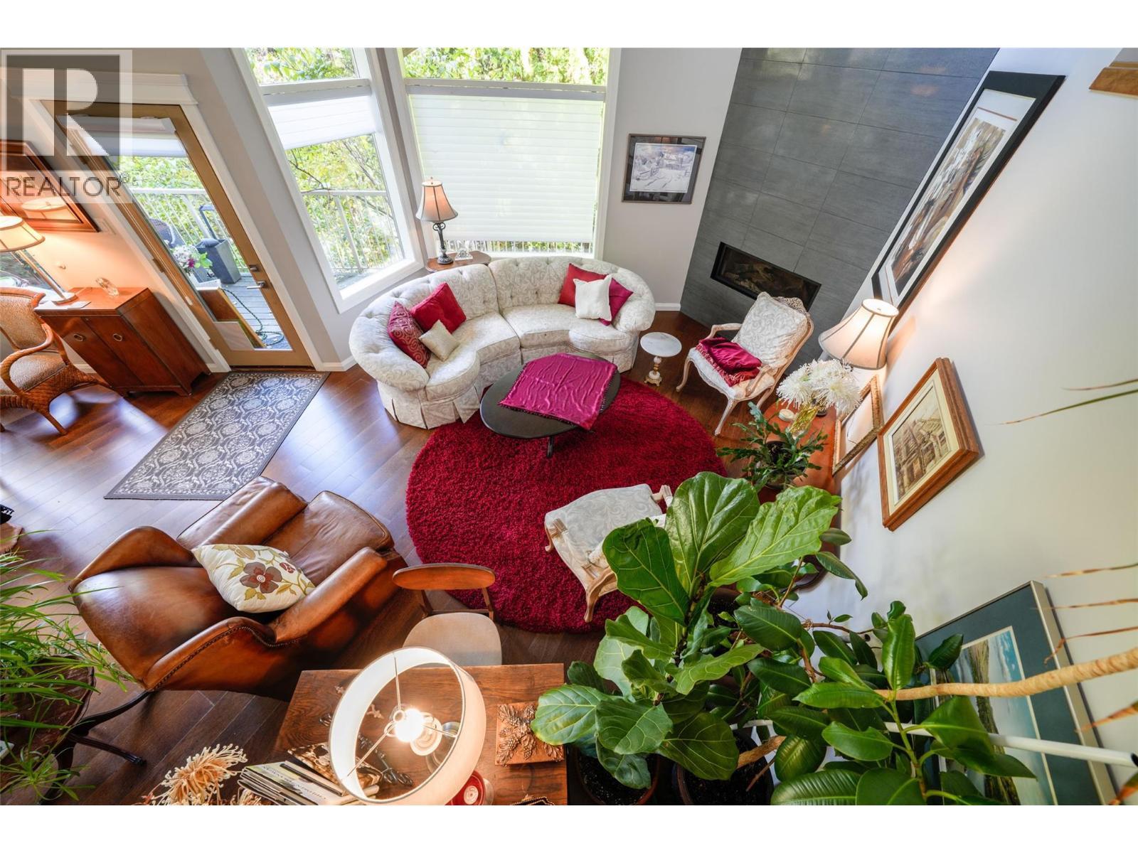 View looking down from the Foyer to the Living room with Cathedral Ceiling - 14038 Ponderosa Way, Coldstream, BC - Indoor Photo Showing Living Room