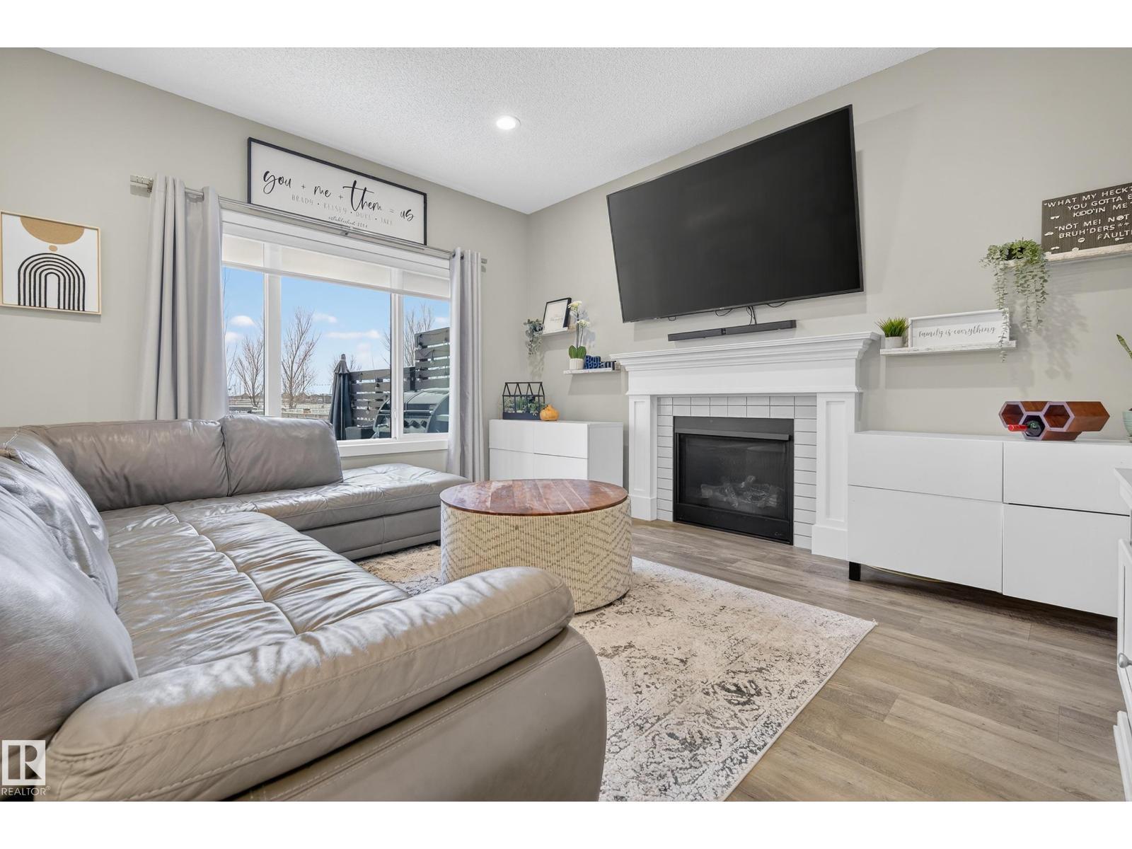 1222 164A St Sw, Edmonton, AB - Indoor Photo Showing Living Room With Fireplace