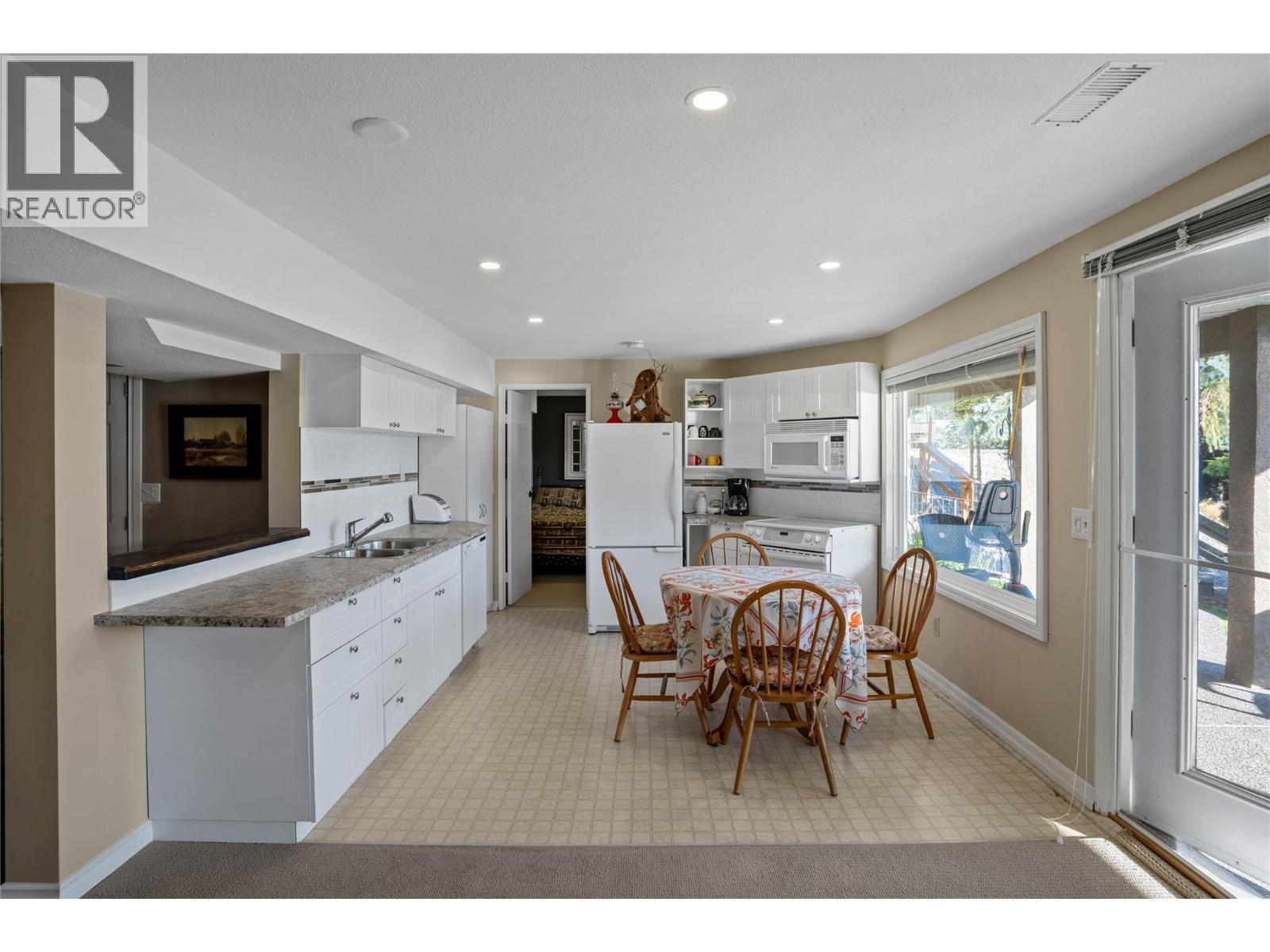 Lower level in-law suite (vacation suite) - 1988 Dewdney Road, Kelowna, BC - Indoor Photo Showing Dining Room