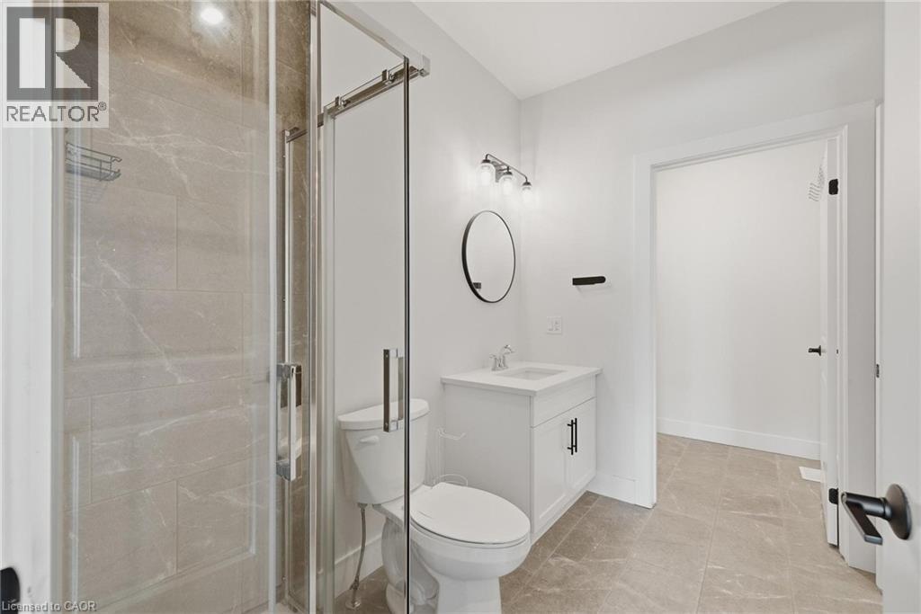 Full bathroom with vanity and a shower stall - 4 Elgin Street W, Norwich, ON - Indoor Photo Showing Bathroom