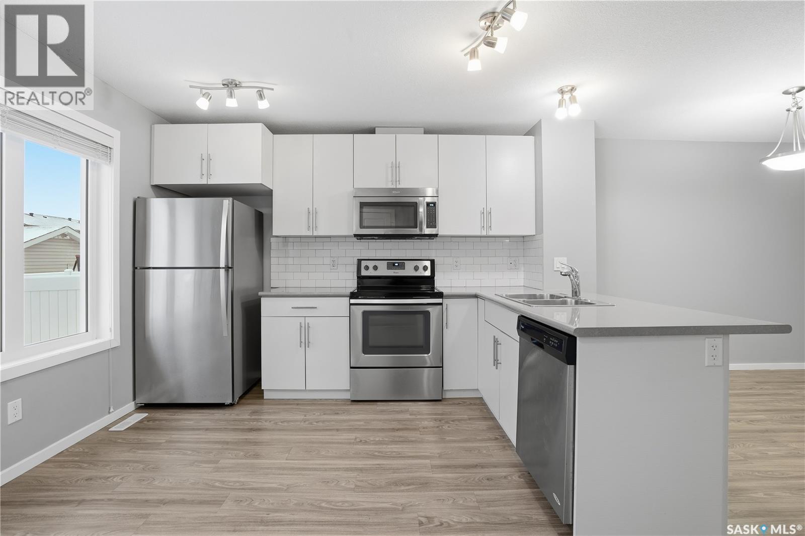 3429 Green Lavender Drive, Regina, SK - Indoor Photo Showing Kitchen With Double Sink With Upgraded Kitchen