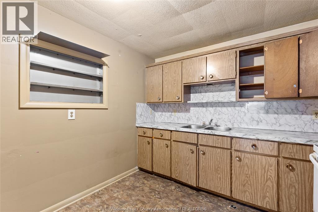 1400-1430 Seneca Street, Windsor, ON - Indoor Photo Showing Kitchen With Double Sink