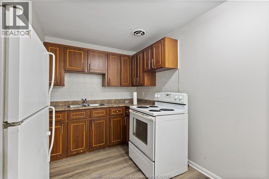 1400-1430 Seneca Street, Windsor, ON - Indoor Photo Showing Kitchen With Double Sink