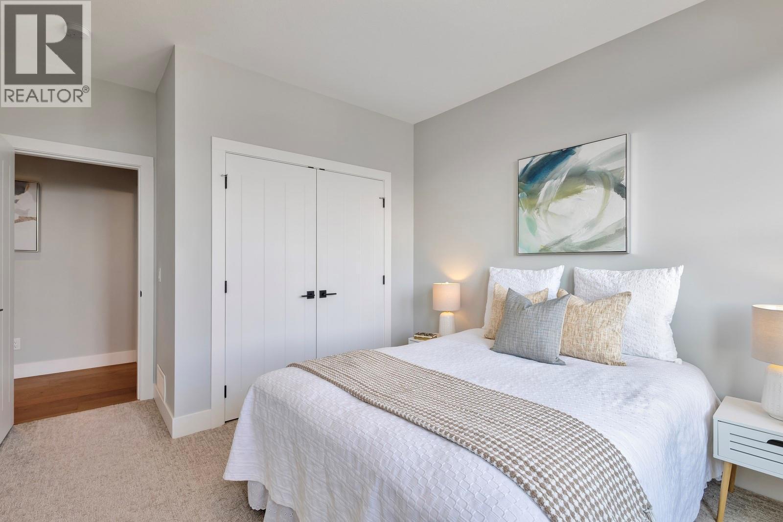 Second bedroom - good sized closet - 2594 Crown Crest Drive, West Kelowna, BC - Indoor Photo Showing Bedroom