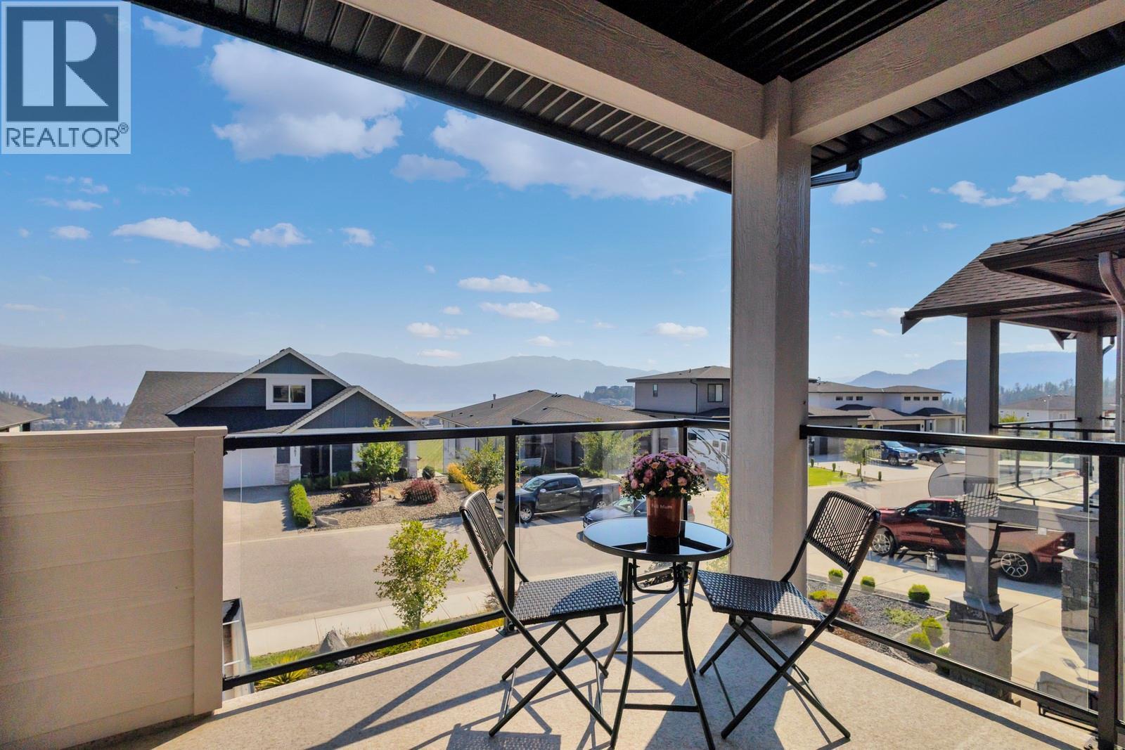Lake views from the kitchen/living area with a covered patio off the front - 2594 Crown Crest Drive, West Kelowna, BC - Outdoor