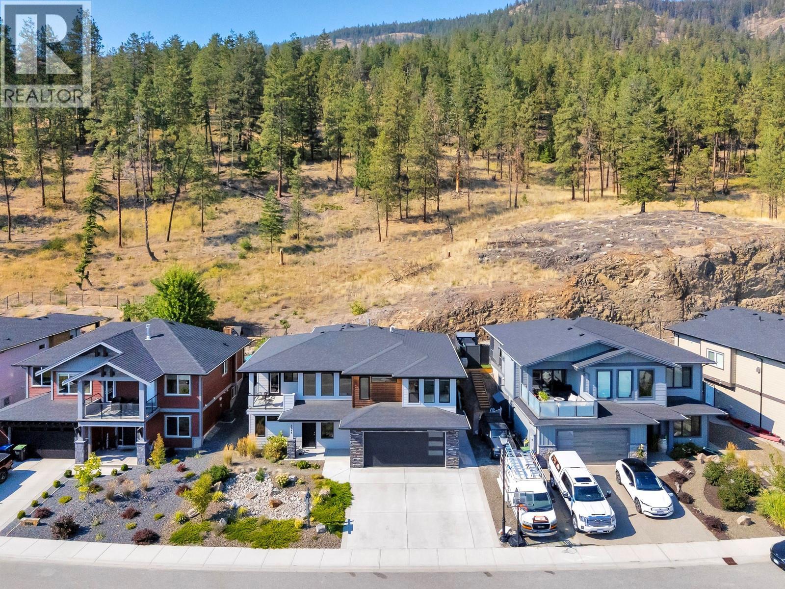 Backs onto green space - 2594 Crown Crest Drive, West Kelowna, BC - Outdoor With Facade