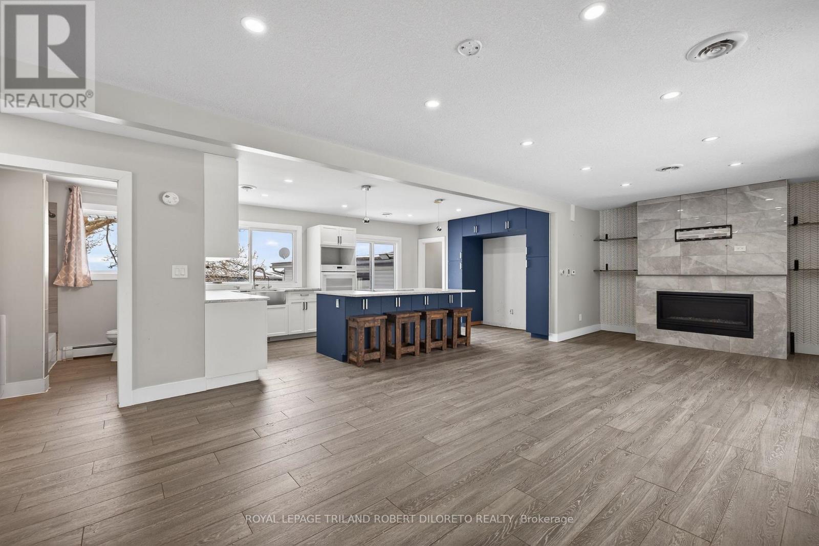 9755 Longwoods Road, Middlesex Centre, ON - Indoor Photo Showing Other Room With Fireplace