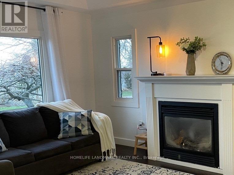 851 Lake Drive E, Georgina, ON - Indoor Photo Showing Living Room With Fireplace