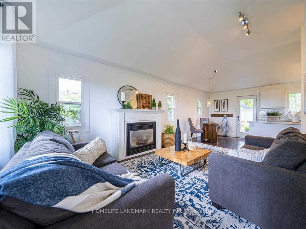 851 Lake Drive E, Georgina, ON - Indoor Photo Showing Living Room With Fireplace